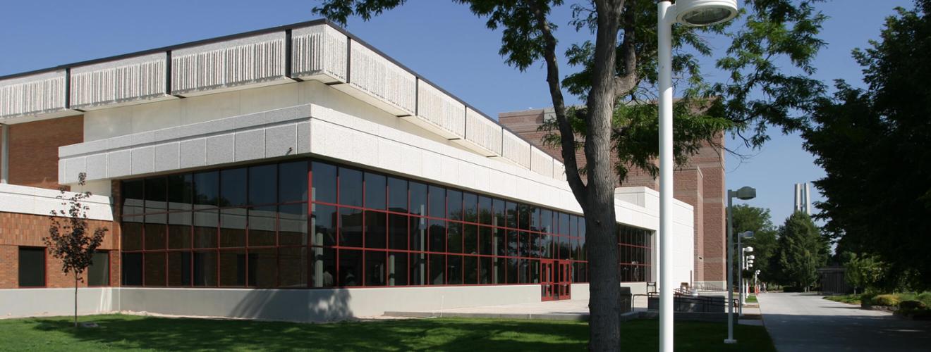 Fine Arts Building with large panel windows and red doors
