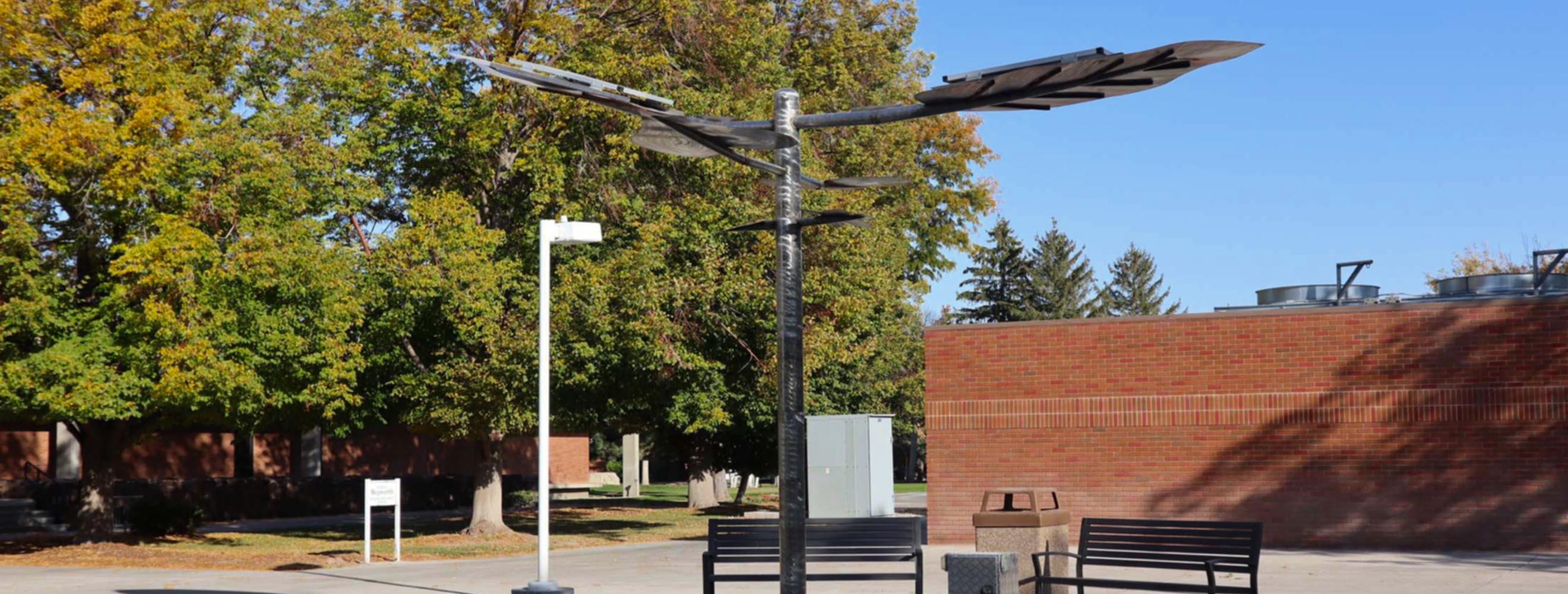 Solar Charging Tree made of metal and charges student devices.